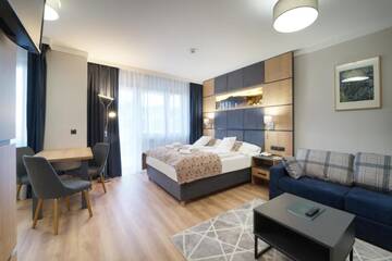 Фото номера Улучшенные апартаменты Отель Artus Resort г. Карпач 4
